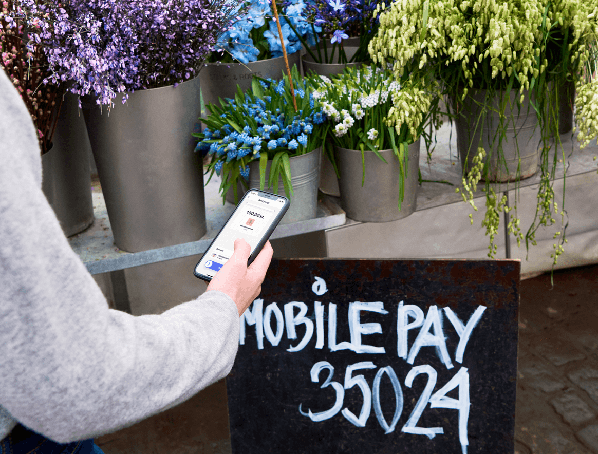 Payment to a flower shop - MobilePay number written on a blackboard